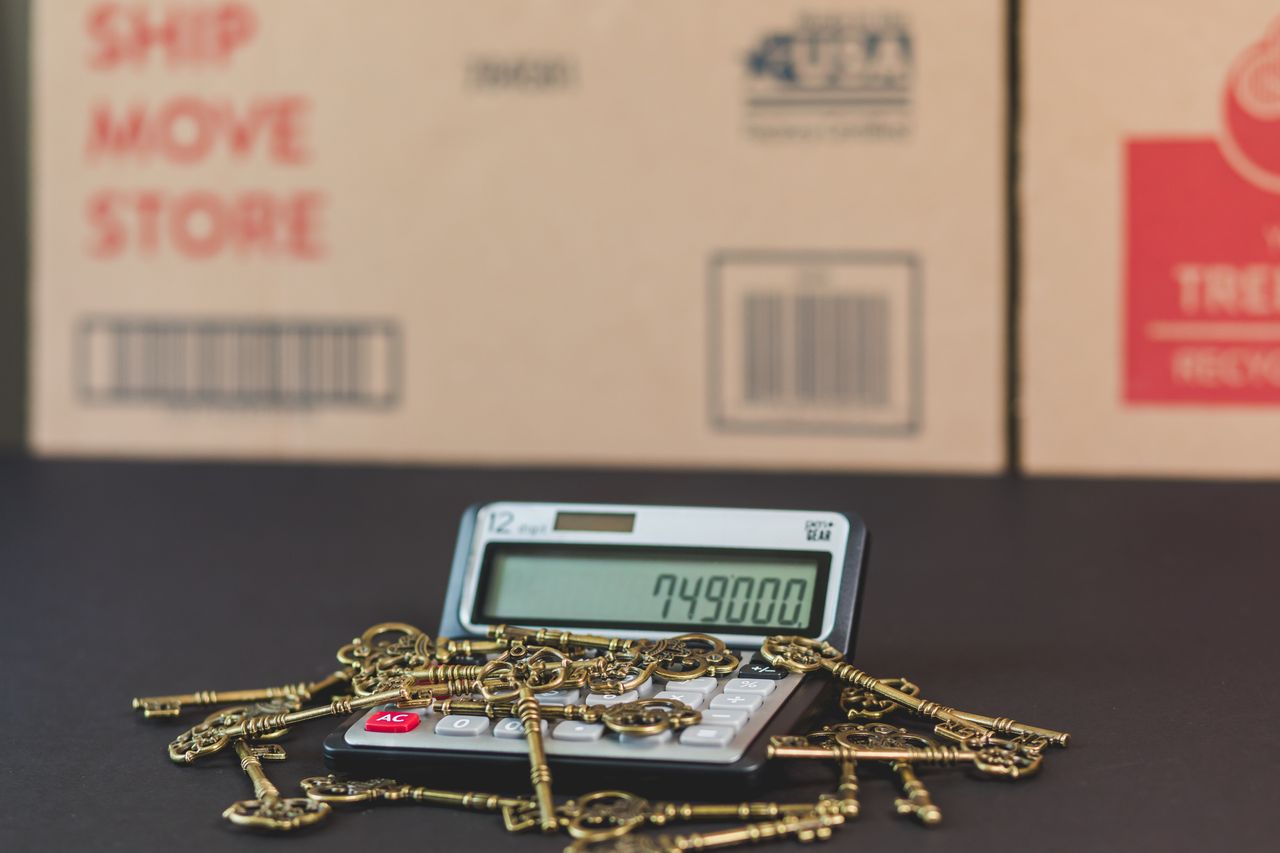 our-services-1 A calculator with vintage keys symbolizes real estate investment and mortgage calculations.